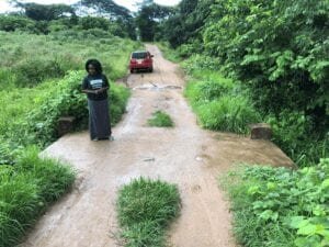Operations manager Emily Nkhoma inspects the renovated Seventh Day road bridge