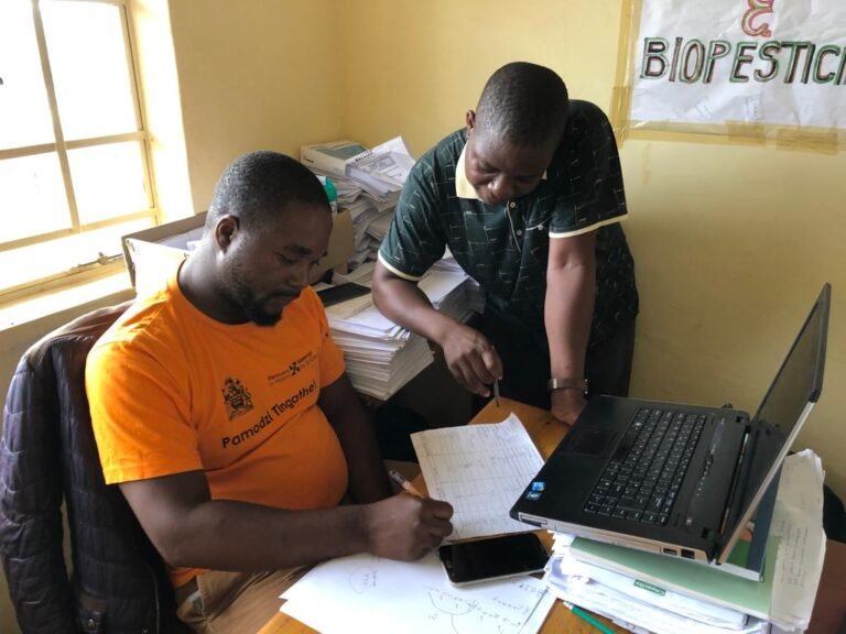 Survey organisers Vincent Mphande and Kennas Jim planning the schedule.